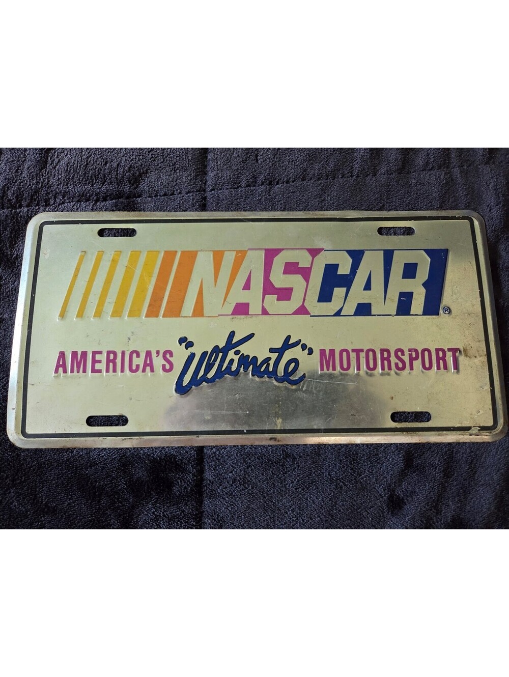 NASCAR “America’s Ultimate Motorsport” Vintage Metal License Plate Sign